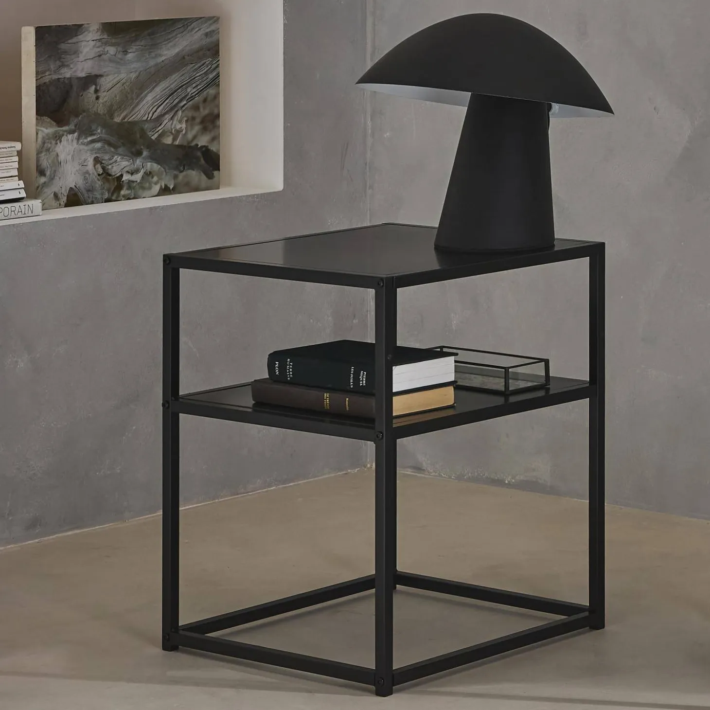 Black metal bedside table with shelf