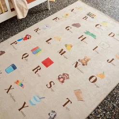 Children's indoor rug beige with French alphabet print