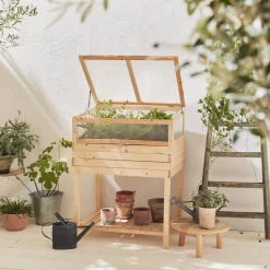 Elevated wooden planter with polycarbonate greenhouse