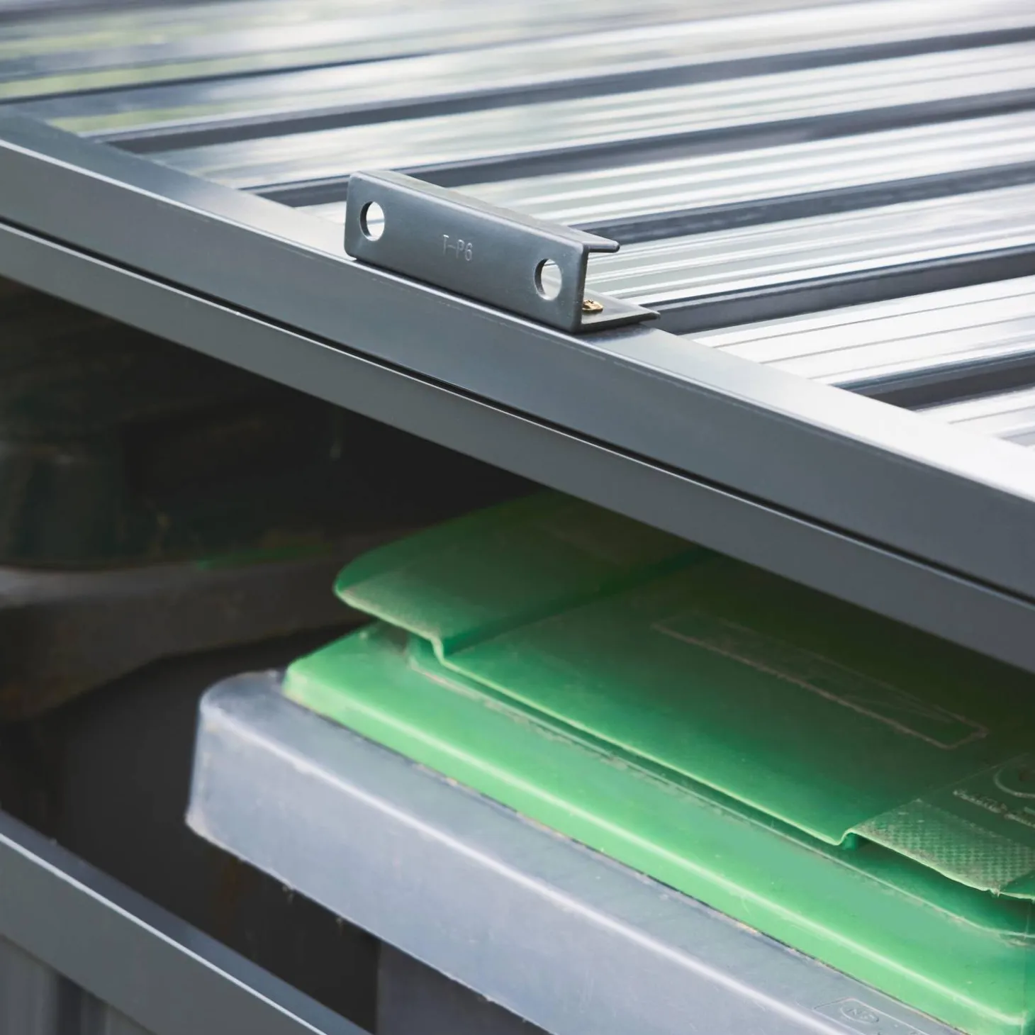 Grey galvanised steel bin shed