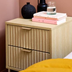 Grooved wood bedside table with metal effect