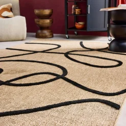 Indoor rug with a jute effect, black in relief graphic pattern.