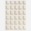 Indoor rug with geometric patterns in cream