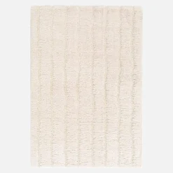 Indoor rug with linear pattern cream