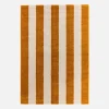 Indoor rug with ochre and white stripes