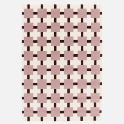 Indoor rug with pink and brown checkered pattern