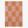 Interior checkered rug orange and pink