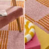 Interior checkered rug orange and pink