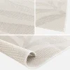 Interior/exterior rug with cream, beige floral pattern