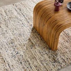 Interior rug with mottled pattern, cream
