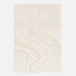 Interior shaggy rug with embossed cream motif