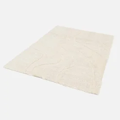 Interior shaggy rug with embossed cream motif