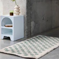 Light blue and cream checkerboard interior rug