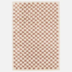 Old pink and cream checkerboard interior rug
