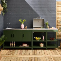 Outdoor kitchen with charcoal barbecue and 3 modules with sink