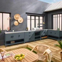 Outdoor kitchen with charcoal barbecue and 5 modules with sink
