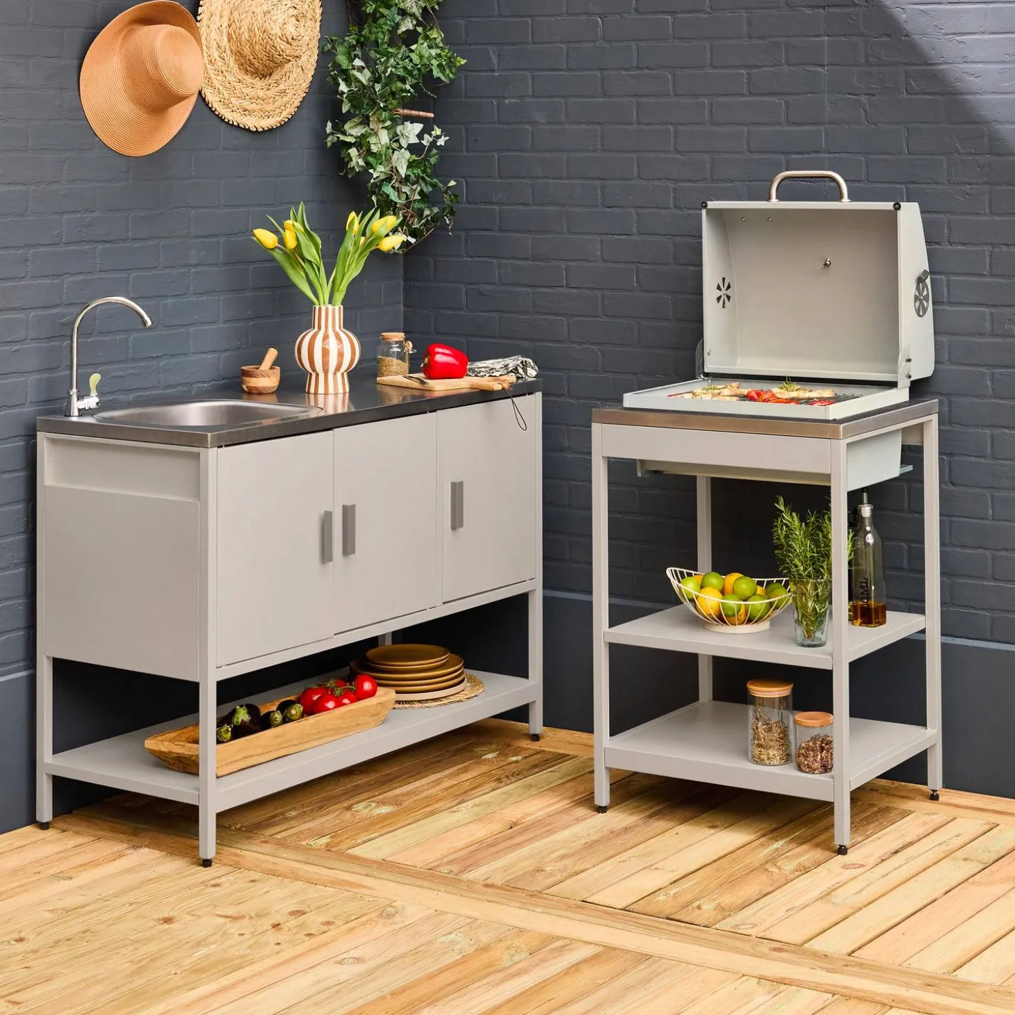 Outdoor kitchen with charcoal barbecue and 2 modules with sink