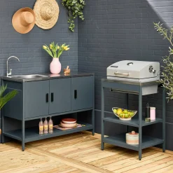 Outdoor kitchen with charcoal barbecue and 2 modules with sink