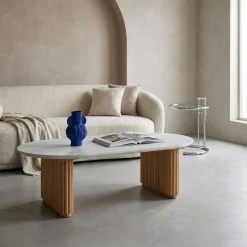 Oval coffee table in rubberwood with stone effect veneer