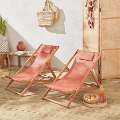 Pair of eucalyptus deck chairs with headrest cushions