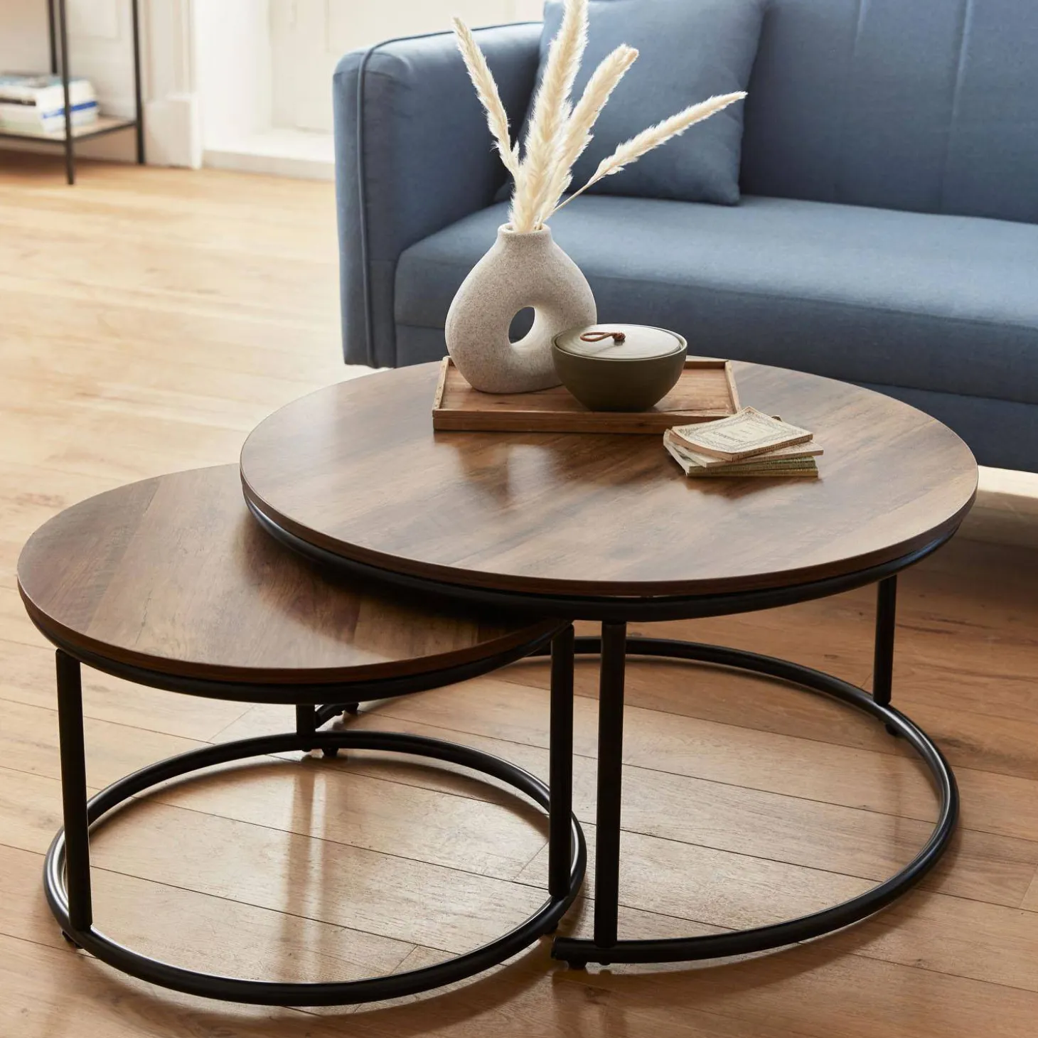 Pair of round nesting coffee tables in wood effect