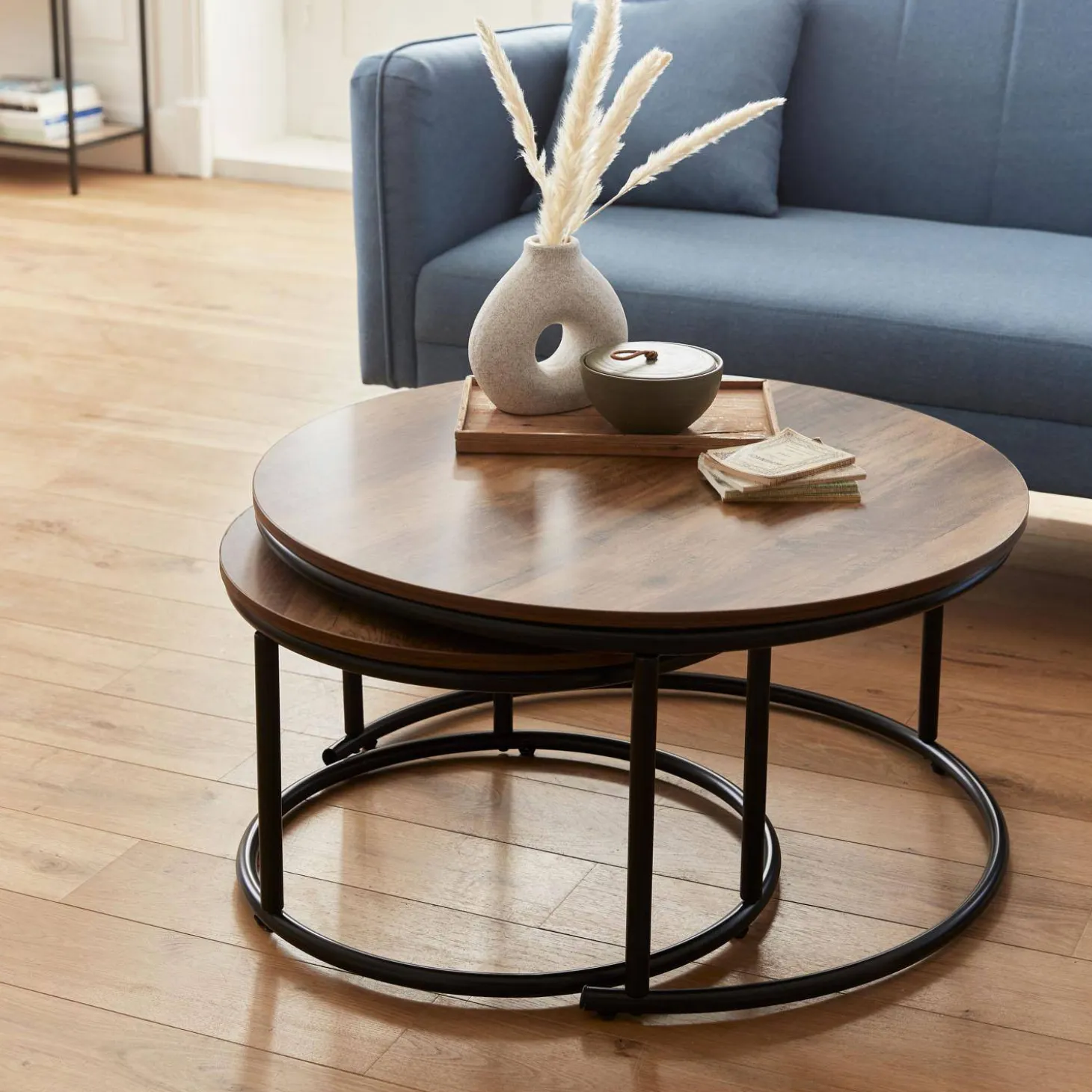 Pair of round nesting coffee tables in wood effect