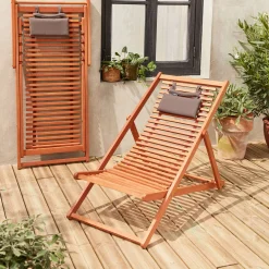Pair of slatted wooden deck chairs