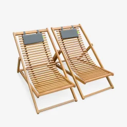 Pair of slatted wooden deck chairs