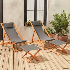 Pair of wooden deckchairs and footrests
