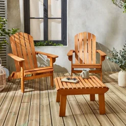 Pair of wooden deck chairs with footrests
