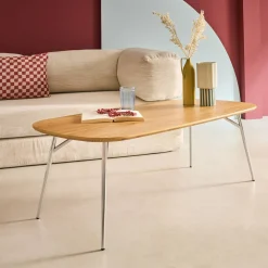 Rectangular coffee table with chrome legs and wood decor