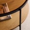 Round coffee table with double glass top, wood decor and metal