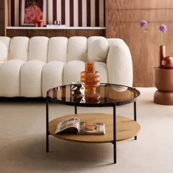 Round coffee table with double glass top, wood decor and metal