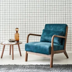 Scandi-style armchair in velvet and light walnut-stained hevea wood