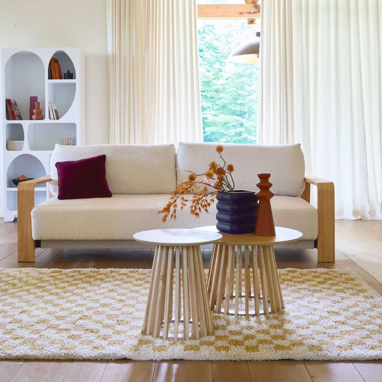 3-seater sofa bed in white boucle with wooden armrests