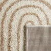 Shaggy indoor rug, rainbow geometric patterns, beige.