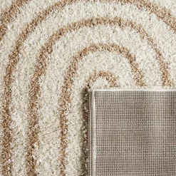 Shaggy indoor rug, rainbow geometric patterns, beige.