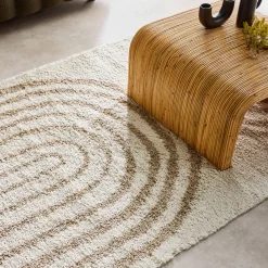 Shaggy indoor rug, rainbow geometric patterns, beige.