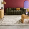 Shaggy indoor rug, rainbow geometric patterns, beige.