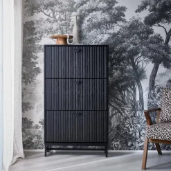 Shoe cabinet with grooved doors