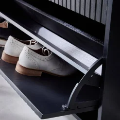 Shoe cabinet with grooved doors