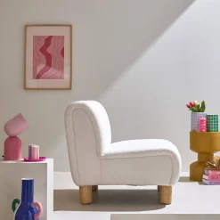 Wooden armchair with rounded legs in boucle fabric