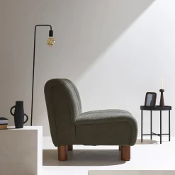 Wooden armchair with rounded legs in boucle fabric