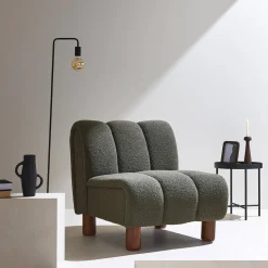 Wooden armchair with rounded legs in boucle fabric